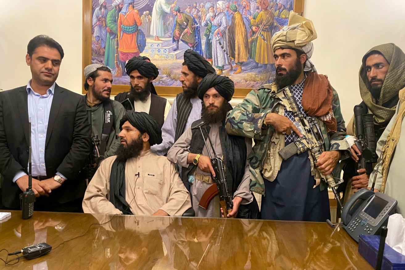 Taliban fighters take control of Afghan presidential palace after the Afghan President Ashraf Ghani fled the country, in Kabul, Afghanistan. (AP Photo/Zabi Karimi)