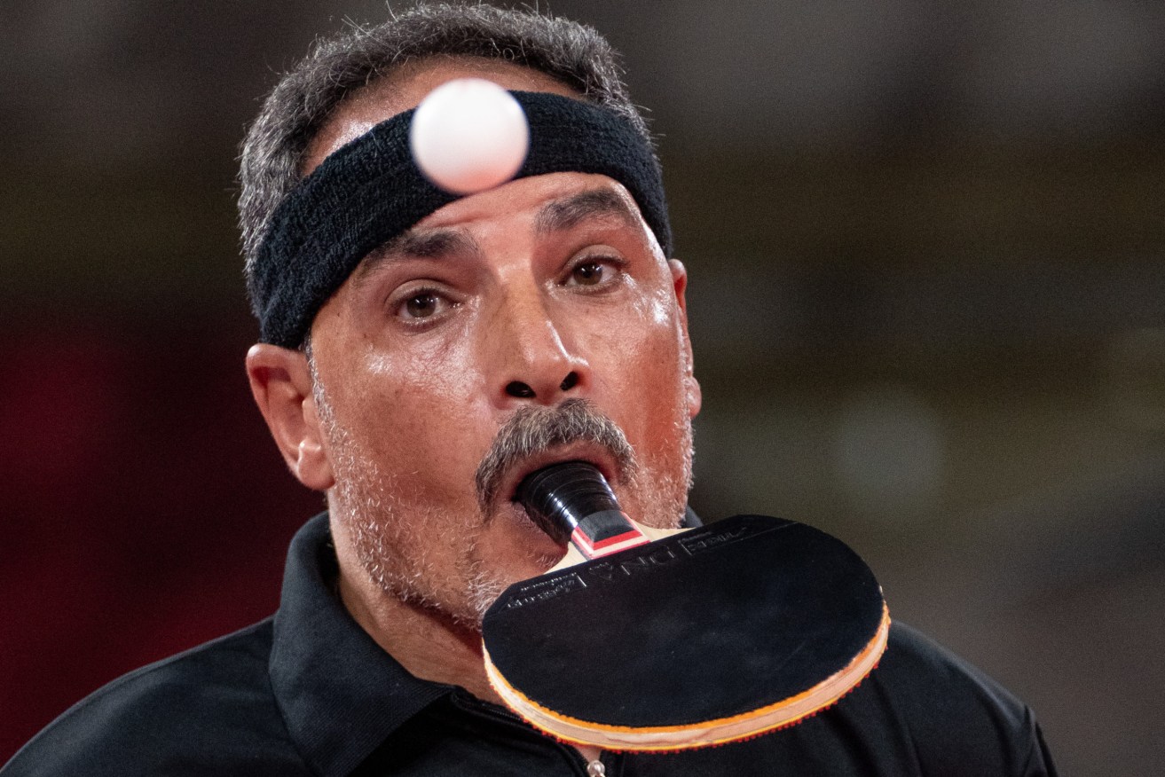 Egyptian table tennis player Ibrahim Elhusseiny Hamadtou, who holds the bat with his mouth and serves with his toes because he has no arms, is typical of the inspiring athletes on show during the Tokyo Paralympic Games, (AAP Image/OIS/ Bob Martin)