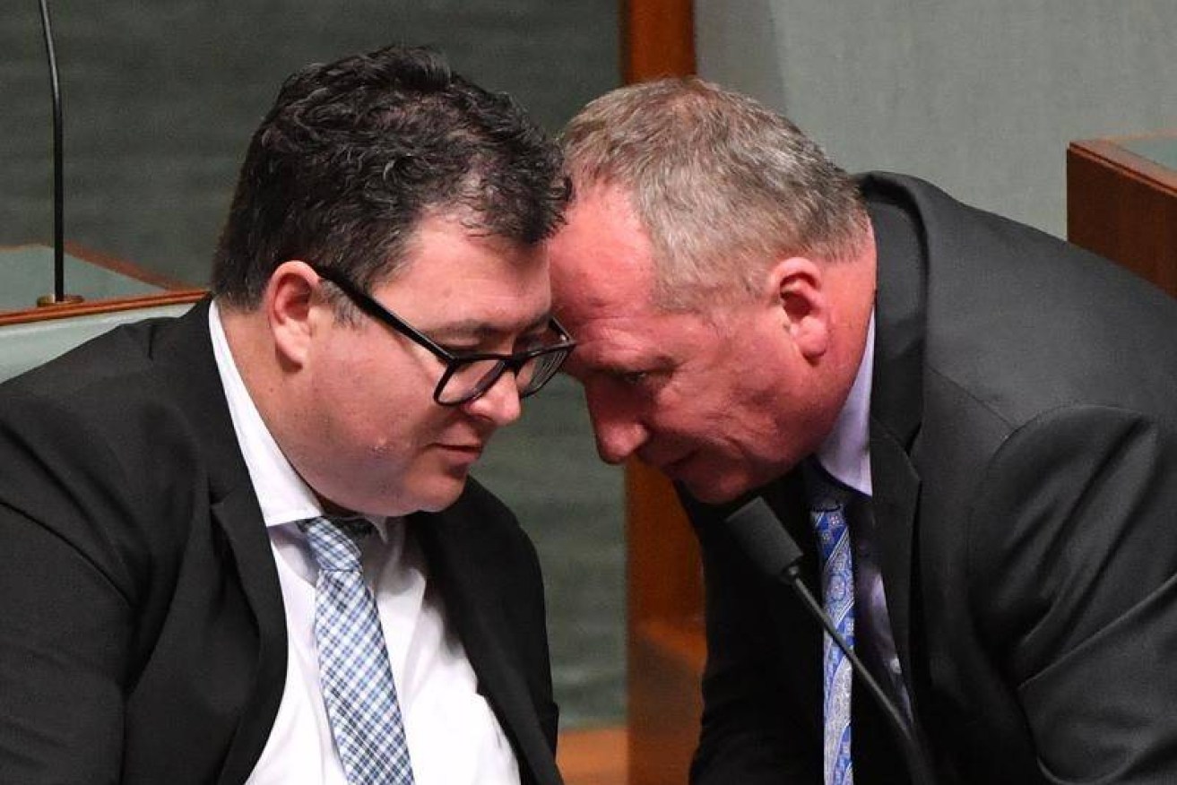Deputy PM Barnaby Joyce has warned fellow MPs of "poking the bear" with rogue MP George Christensen (left). Image: AAP