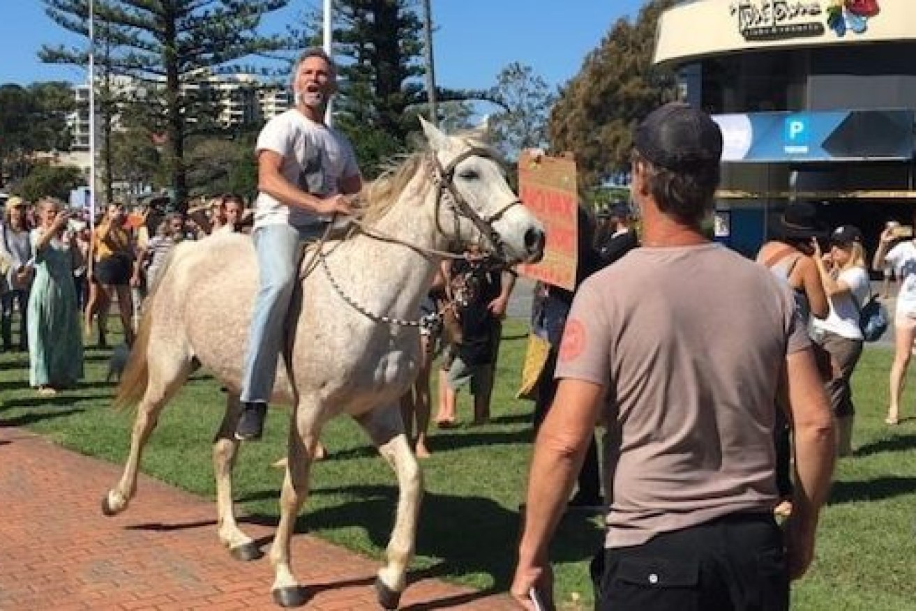 Police say further charges are likely against the man on horseback who incited Sunday's border riots (Photo: ABC North Coast: Hannah Ross)
