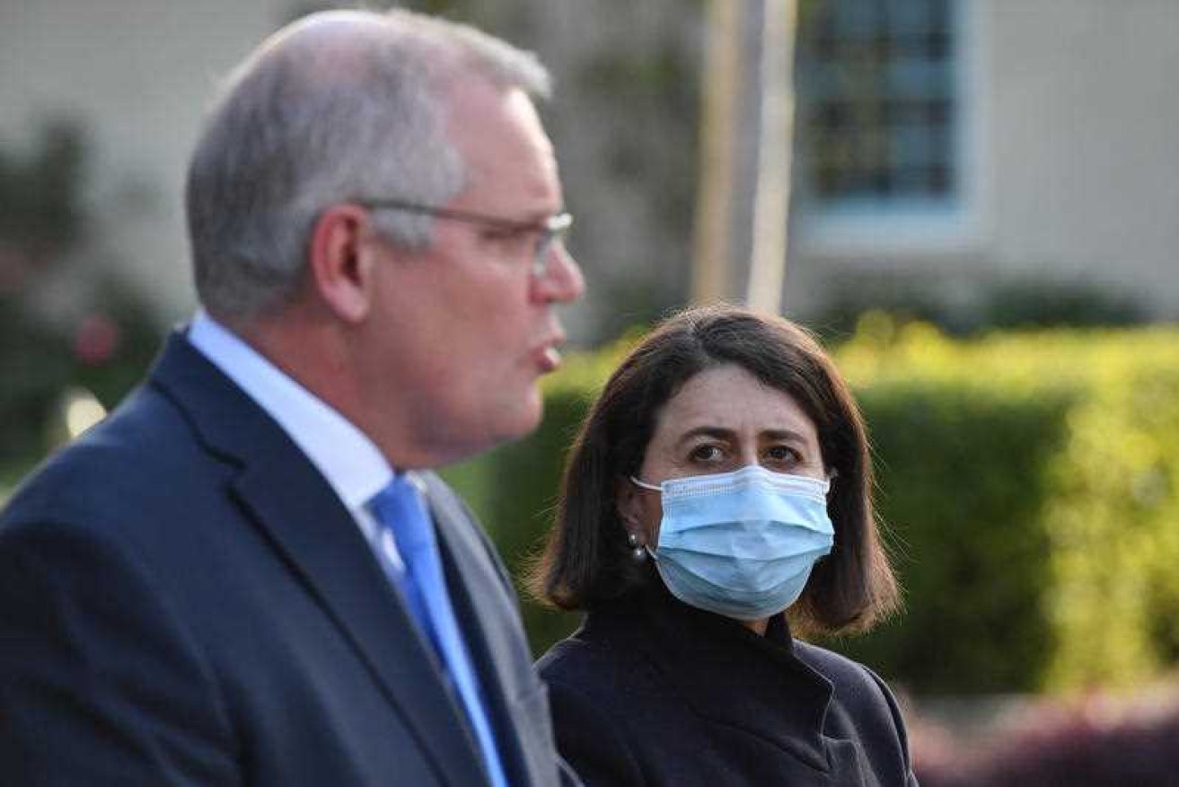 Former NSW Premier Gladys Berejiklian and Prime Minister Scott Morrison photographed together last year before the Premier resigned from office. Their relationship has come back under scrutiny after the release of damning text messages.
 (Photo: AAP).