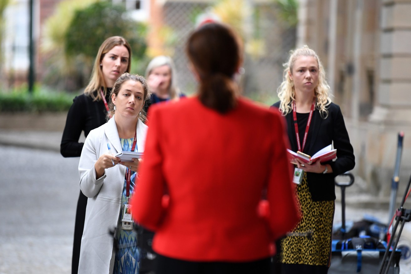 Reporters listen to Queensland Premier Annastacia Palaszczuk during a press conference at Parliament House in Brisbane, Wednesday, May 20, 2020. (AAP Image/Dan Peled) 
