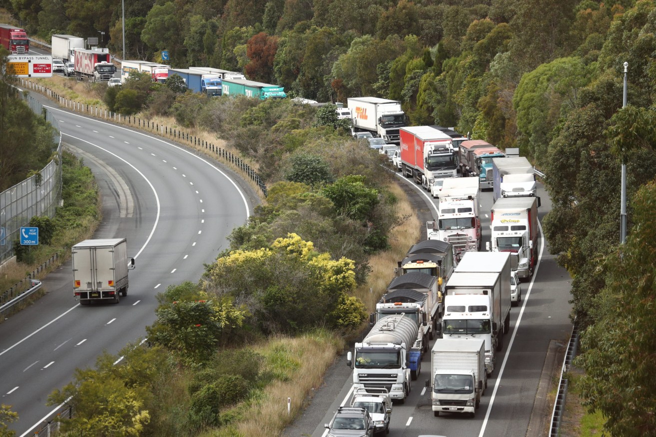 Scenes on the Pacific Motorway at the Queensland and New South Wales border  on the Gold Coast, Friday, July 23, 2021. (AAP Image/Jason O'Brien) 