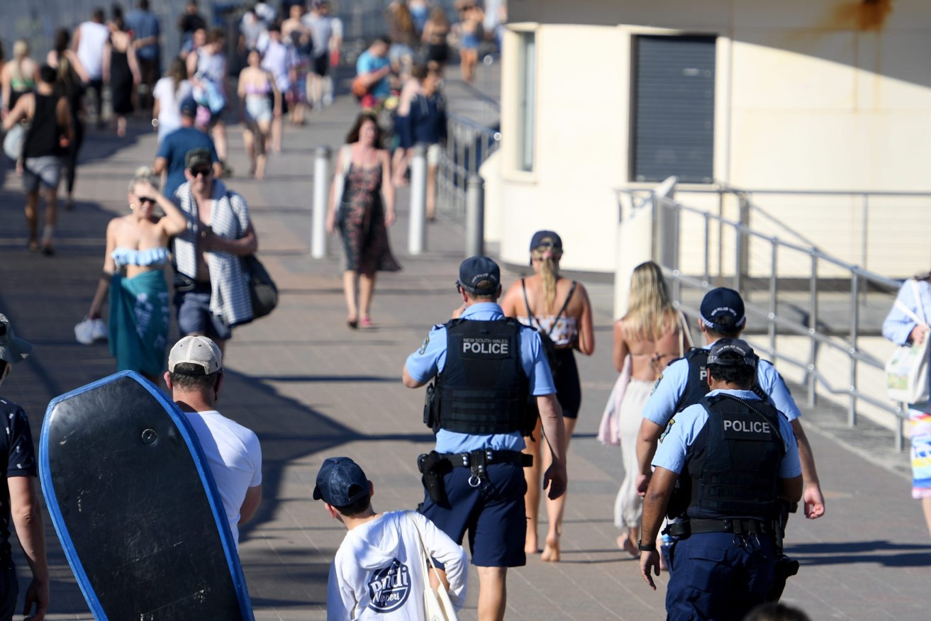 Police patrol Bondi beach at the weekend as hot sunny weather brought crowds back outdoors in Sydney. (AAP Image/Dan Himbrechts)