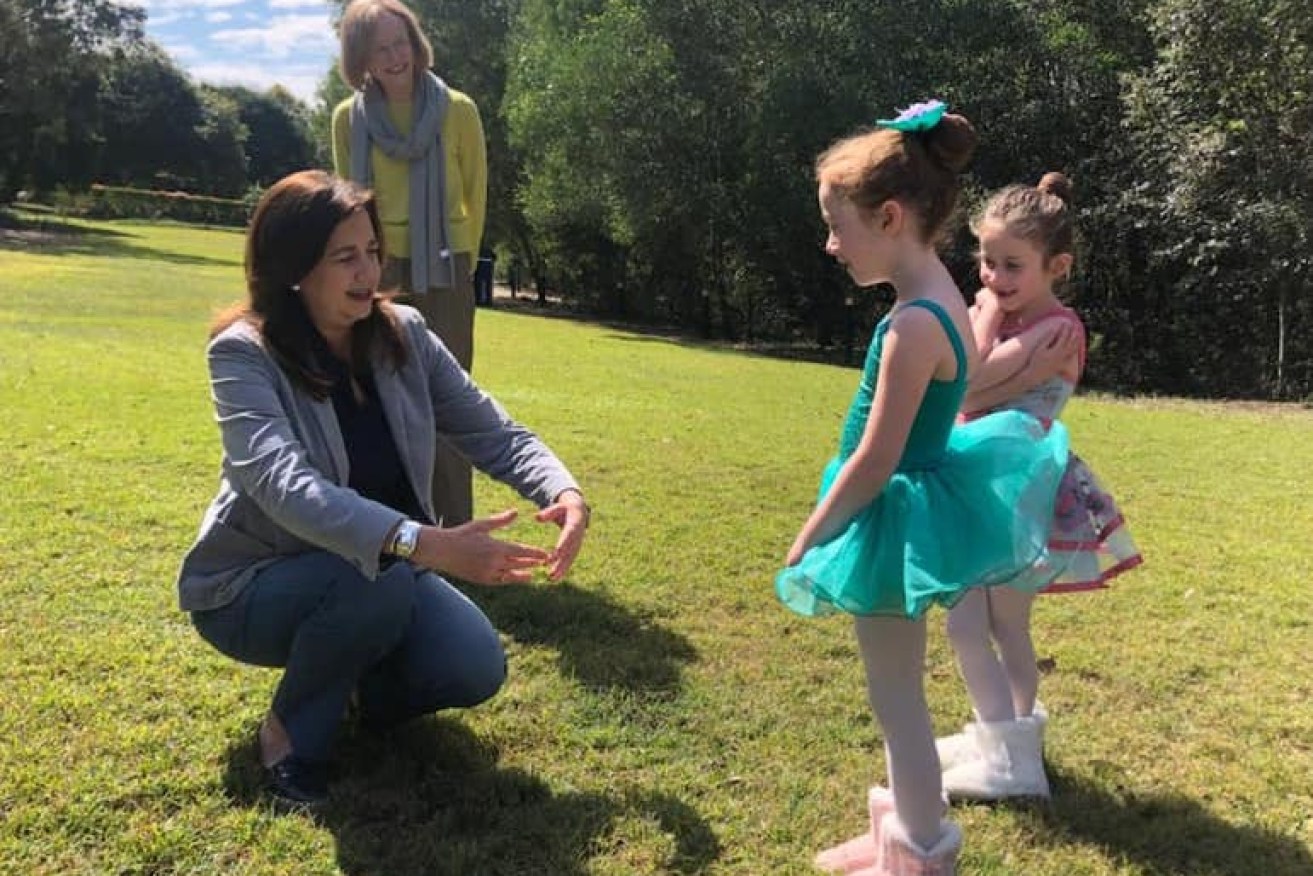 Premier Annastacia Palaszczuk (front) and Chief Health Officer Jeannette Young (rear) met some children recently at the park. (Facebook)
