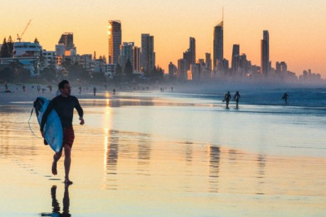 Gold Coast holiday makers hold their nerve amid concerns over new Covid variant