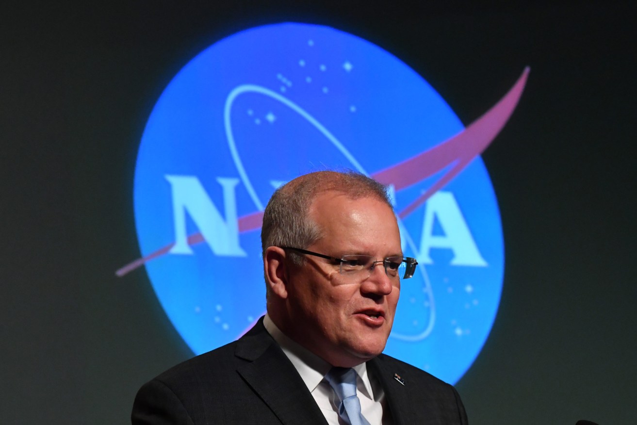 Australia's Prime Minister Scott Morrison at the NASA headquarters in Washington DC, United States, Saturday, September 21, 2019. Scott Morrison signs a Statement of Intent committing $150 million to NASa's Artemis Project. (AAP Image/Mick Tsikas) NO ARCHIVING