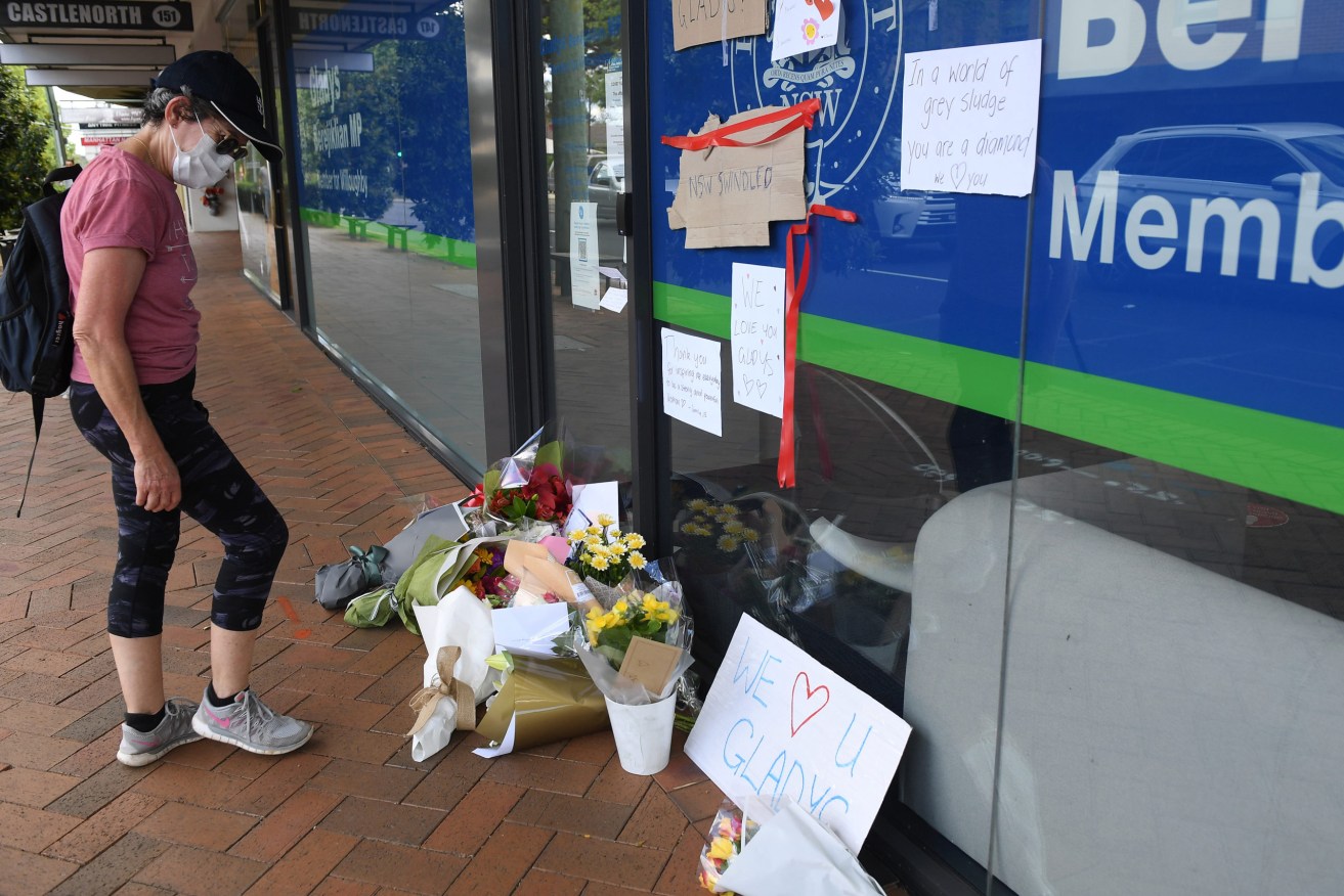 Messages and flowers outside the electoral office of ex-NSW premier Gladys Berejiklian after she resigned her post. (AAP Image/Dan Himbrechts) 