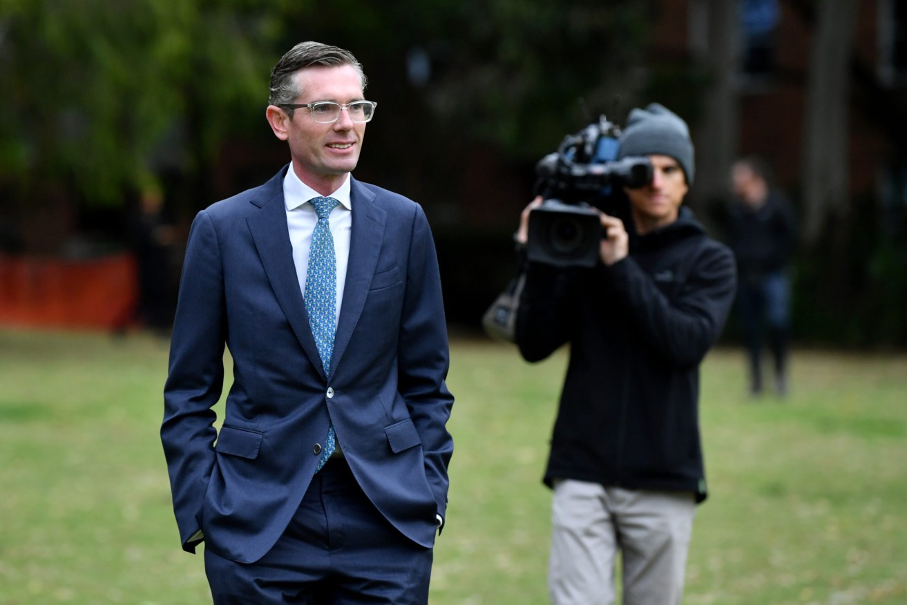 NSW Premier Dominic Perrottet leaves a press conference in Sydney. (AAP Image/Joel Carrett) 