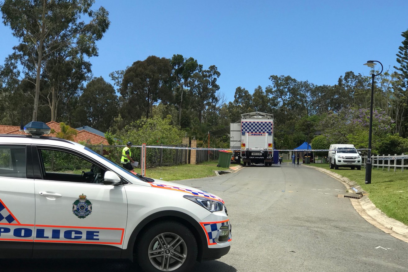 Police at the scene of the discovery of Kym Cobby's body outside her home in Worongary on the Gold Coast in 2017. (AAP Image/Murray Wenzel) 