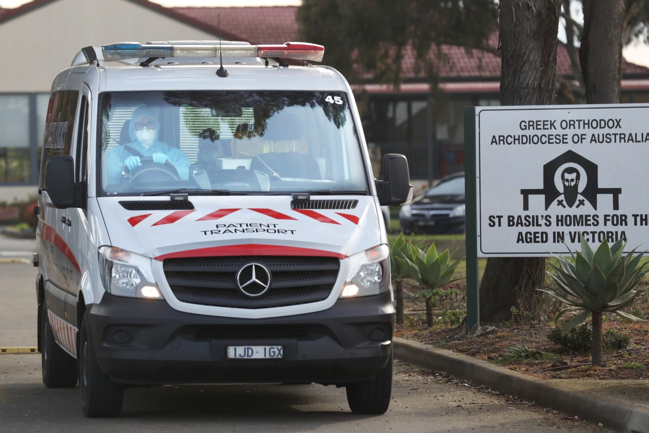Medical staff preparing to transport people from the St Basil’s Home for the Aged Care in Fawkner, Melbourne where there was an outbreak of Covid-19 in July. Peter Rozen QCAAP Image/David Crosling) 