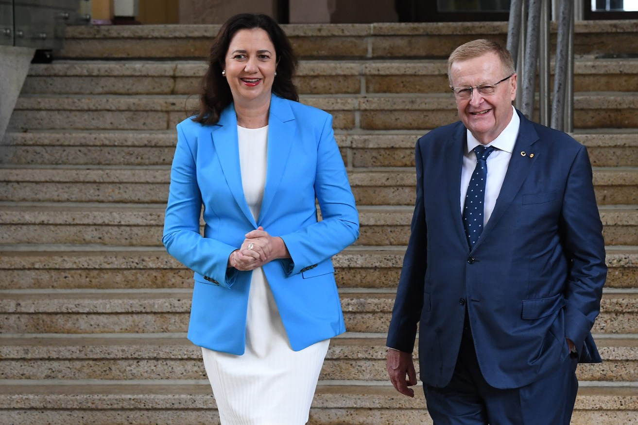 Queensland Premier Annastacia Palaszczuk (left) and AOC President John Coates (right) are seen after a media conference announcing Queensland's bid to host the 2032 Olympics in Brisbane. (AAP Image/Darren England) 