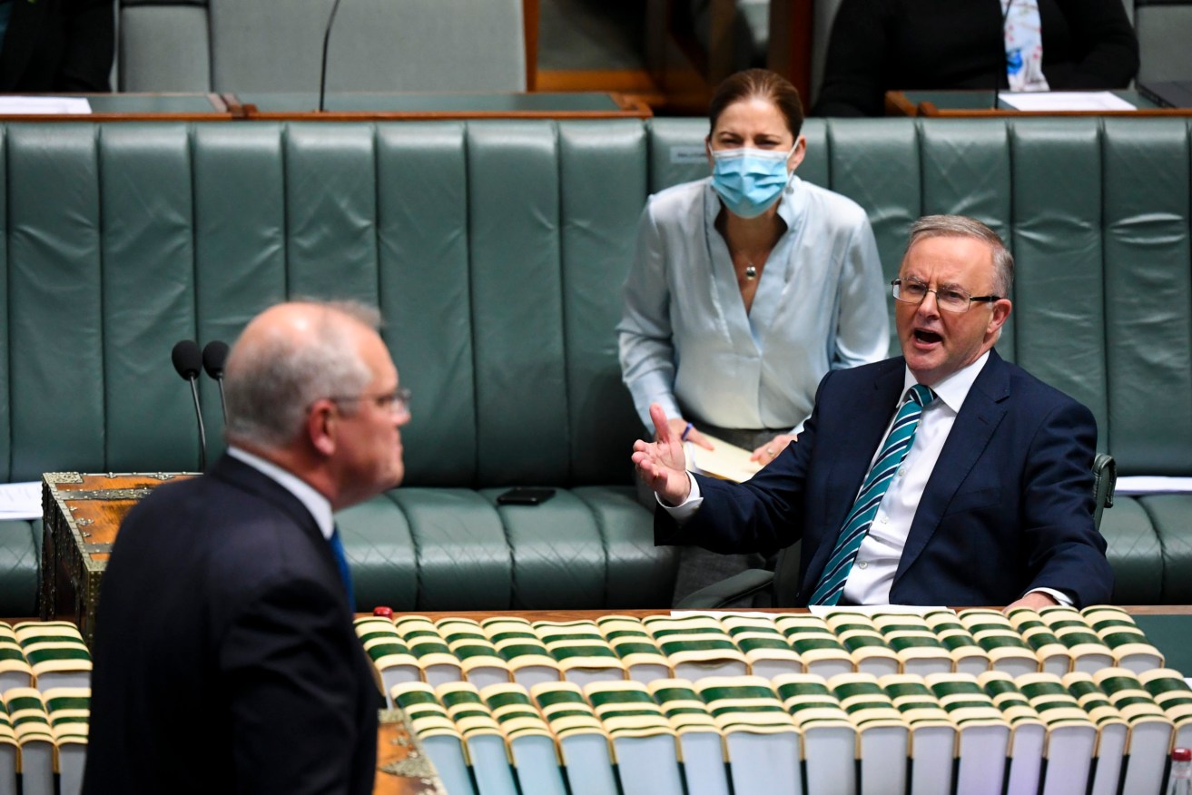 Opposition Leader Anthony Albanese reacts as he listens to Prime Minister Scott Morrison during Question Time at Parliament House earlier this year. (AAP Image/Lukas Coch)