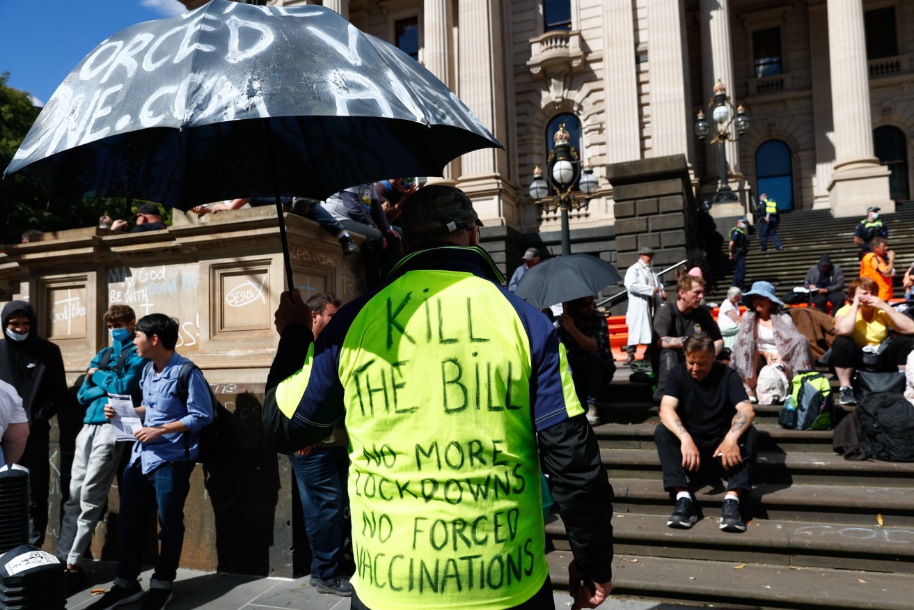 Demonstrations against pandemic legislation outside the Victorian State Parliament this week have included a mock execution of the premier (AAP Image/Con Chronis)