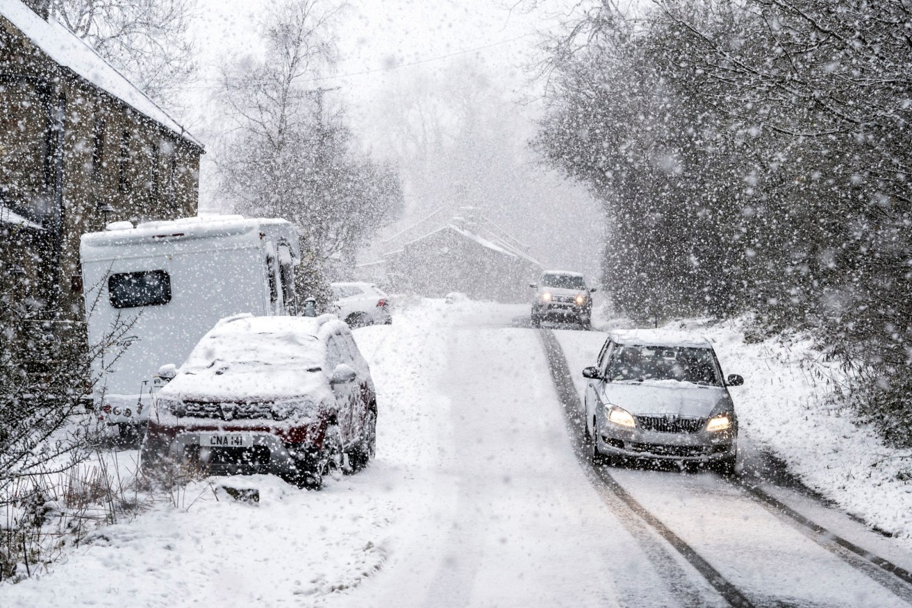  Tens of thousands of people in Scotland and northern England remained without power Sunday after a storm brought sleet, subzero temperatures and disruptions across much of the U.K. (Danny Lawson/PA via AP)
