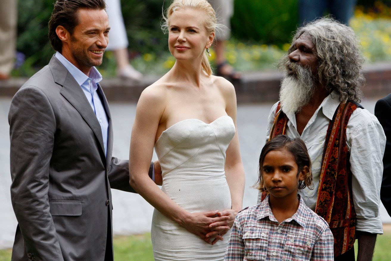 FILE - Australian Indigenous actor David Gulpilil, right, stands with actors Hugh Jackman, left, Nicole Kidman, center, and Brandon Walters, second right, following a press conference for their latest movie "Australia" in Sydney, Tuesday, Nov. 18, 2008. Gulpilil has died of lung cancer, a government leader said on Monday, Nov. 29, 2021. He was 68 years old. (AP Photo/Mark Baker, File)