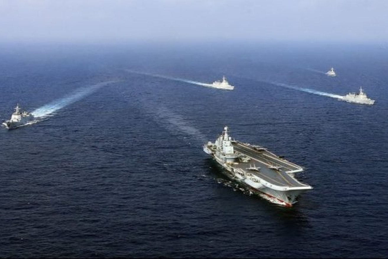 China's aircraft carrier the Liaoning (front), sails with other ships during a drill. (AFP/Getty Images)