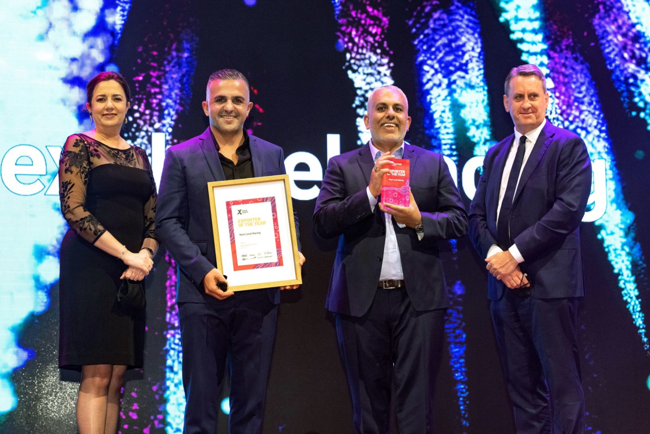 Hess Ghah, CEO of Next level Racing (left) and brother Tony, receiving their Premier of Queensland's 2021 Exporter of the Year award.