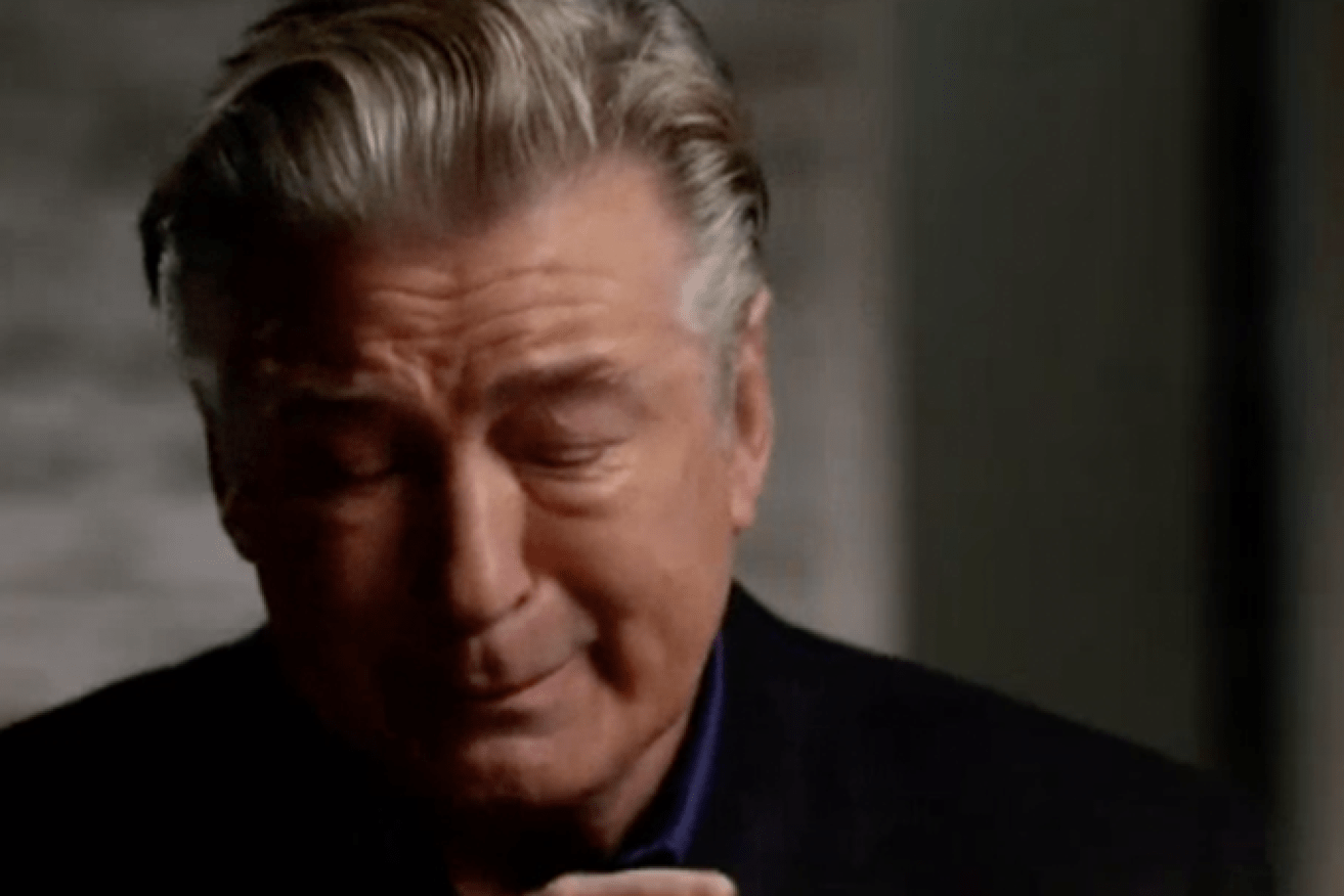 Alec Baldwin has given a tearful interview, speaking for the first time about the fatal movie set shooting. (Image: ABC News (US)).