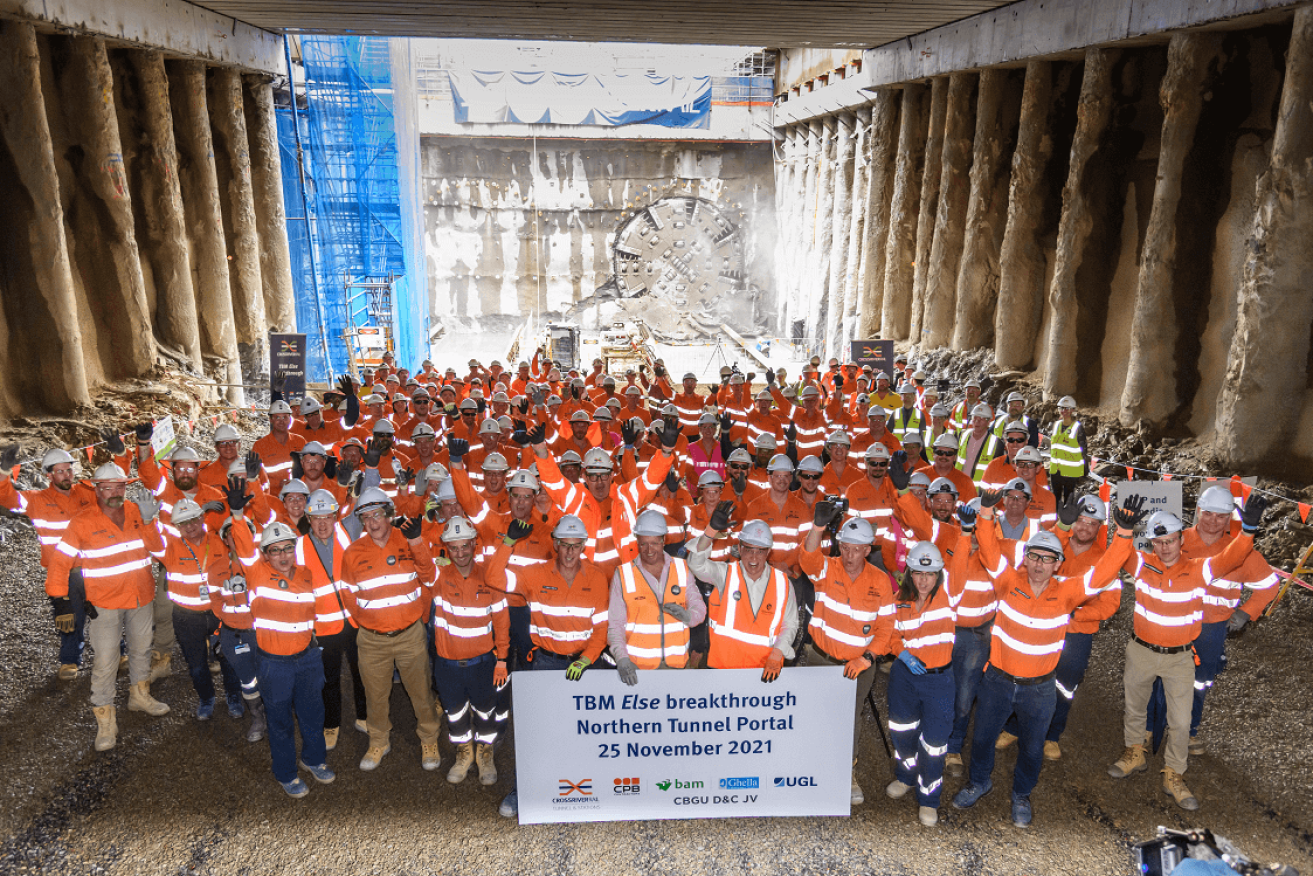 Workers celebrate the first tunnel breakthrough last month. The second tunnel is no complte. (Image:CRR)