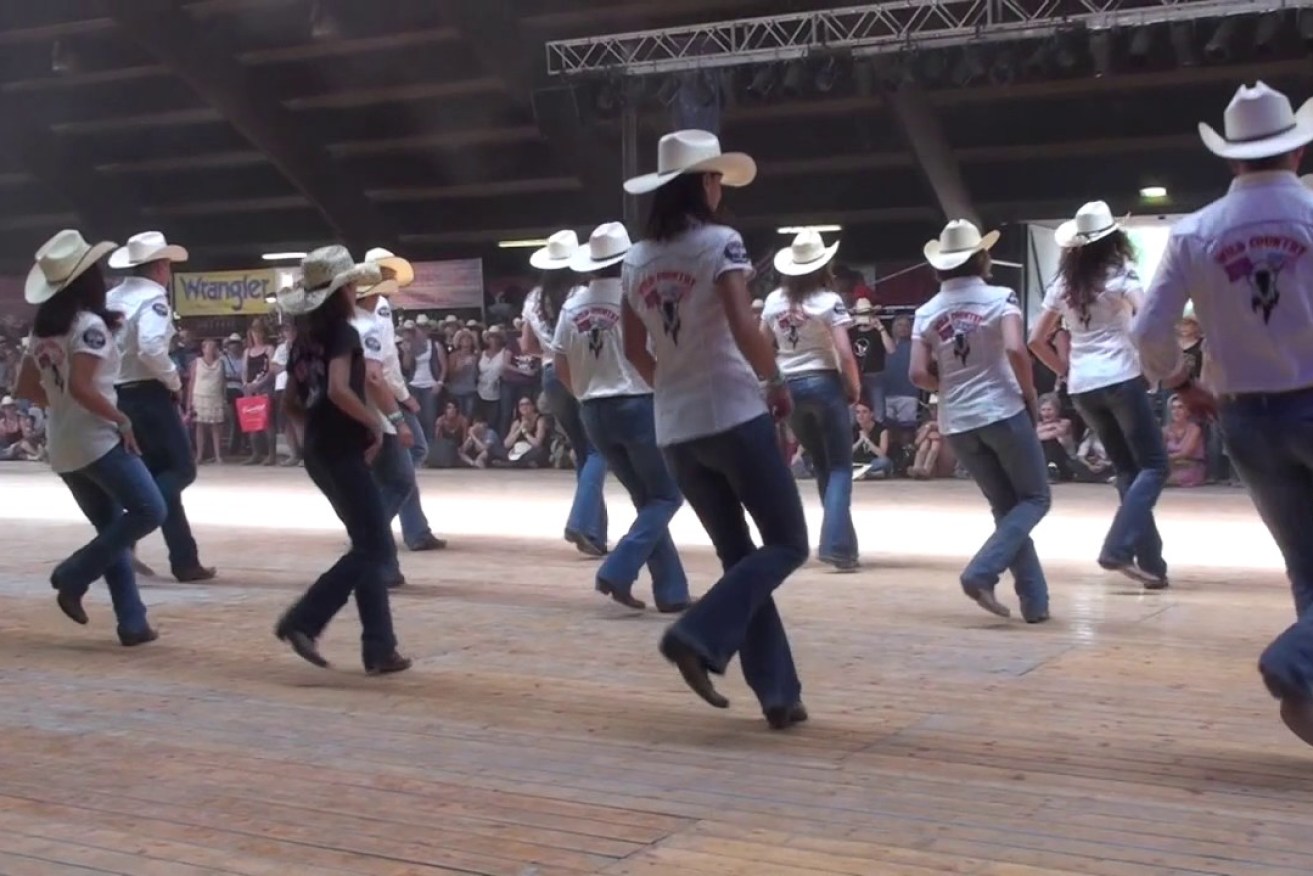 A father and son are accused of fleecing Queensland line dancing enthusiasts of hundreds of thousands of dollars (file image).