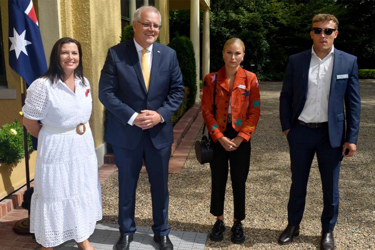 Prime Minister Scott Morrison with his wife Jenny, 2021 Australian of the Year Grace Tame and her partner Max Heerey during a morning tea The Lodge in Canberra. (AAP Image/Mick Tsikas)