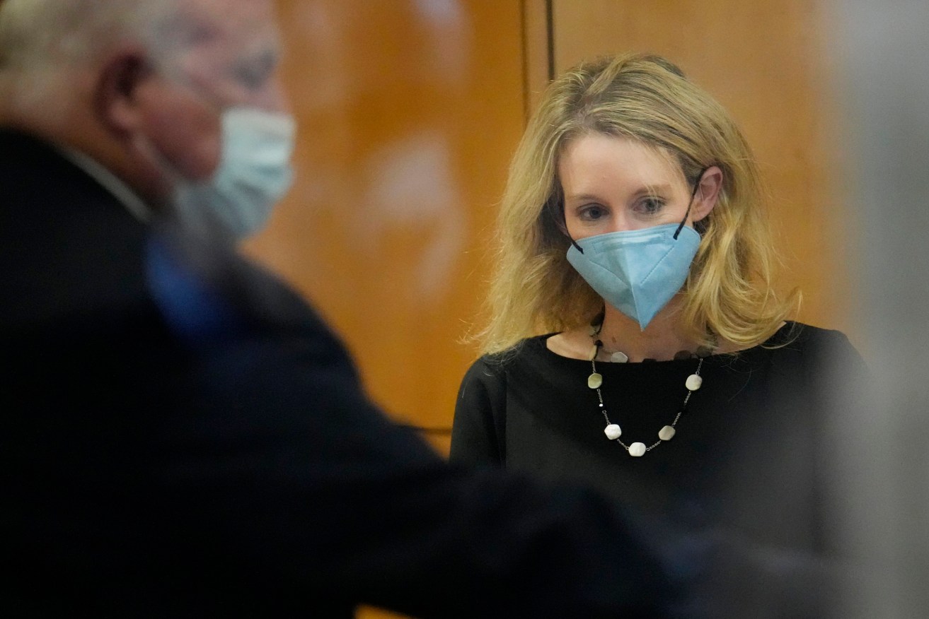 Former Theranos CEO Elizabeth Holmes walks into the Robert F. Peckham Federal Building and U.S. Courthouse for her trial. (AP Photo/Tony Avelar)