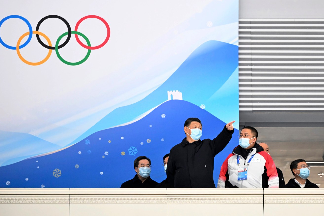 Chinese President Xi Jinping tours the National Speed Skating Oval, a competition venue for the 2022 Winter Olympics in Beijing this week. Competition for the Winter Olympics is scheduled to begin on Feb. 4. (Shen Hong/Xinhua via AP)
