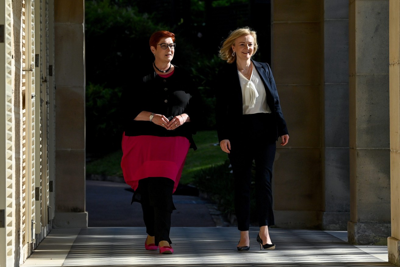 Australian Foreign Minister Marise Payne (left) and British Foreign Secretary Liz Truss arrive for Australia-United Kingdom Ministerial Consultations (AUKMIN) talks at Admiralty House, in Sydney. Truss is one of two final candidates to become Britain's next PM. (AAP Image/Bianca De Marchi) 