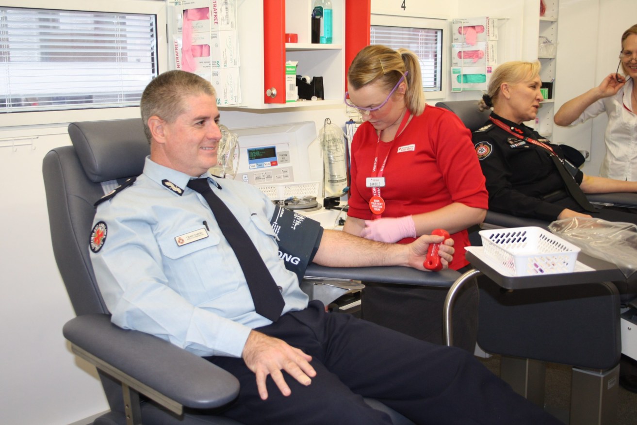 Ambulance boss Craig Emery pictured recently donating blood. (Image: QPS)