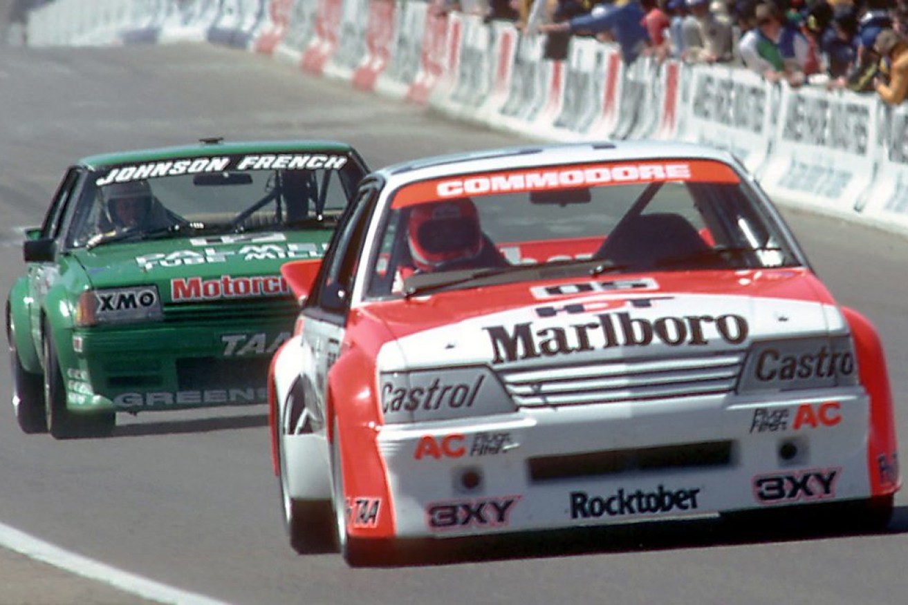 The 1980s battle between Peter Brock and Queenslander Dick Johnson epitomised the Holden v Ford rivalry. (Image: Supplied)