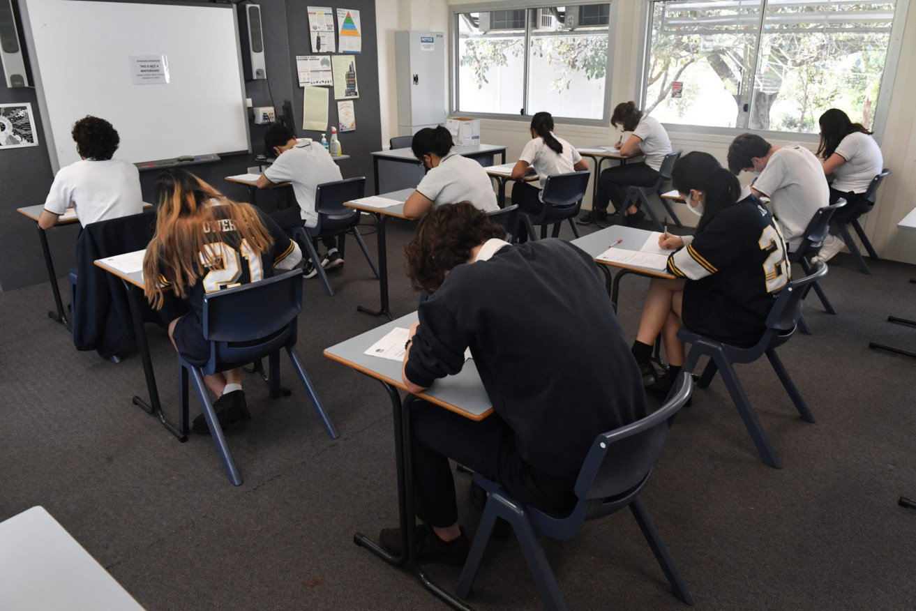 Australia's rates of high school completion have hit record lows thanks to Covid interruptions.  (AAP Image/Mick Tsikas) 