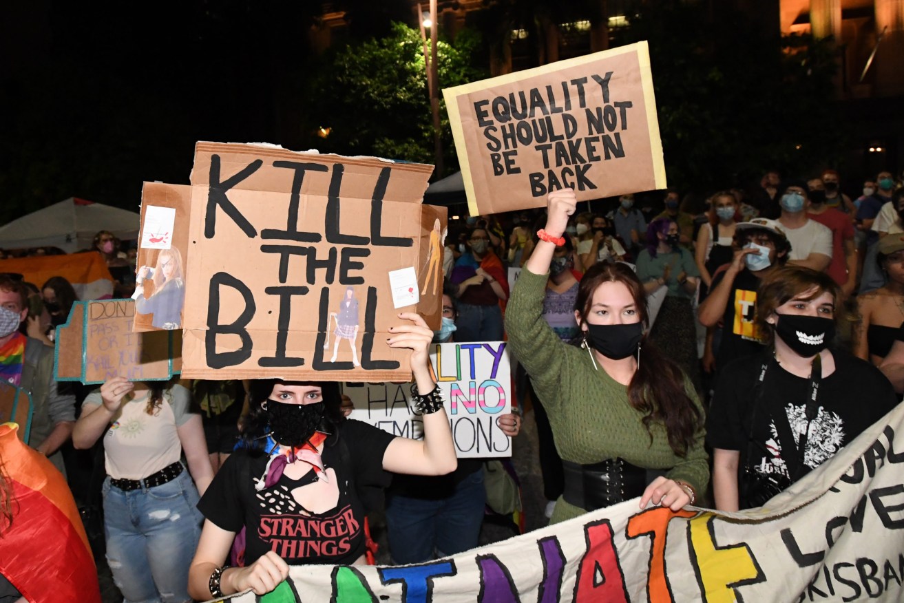Protestors are seen marching through the CBD of Brisbane opposing the Federal Governments Religious Discrimination Bill, Wednesday. (AAP Image/Darren England) 