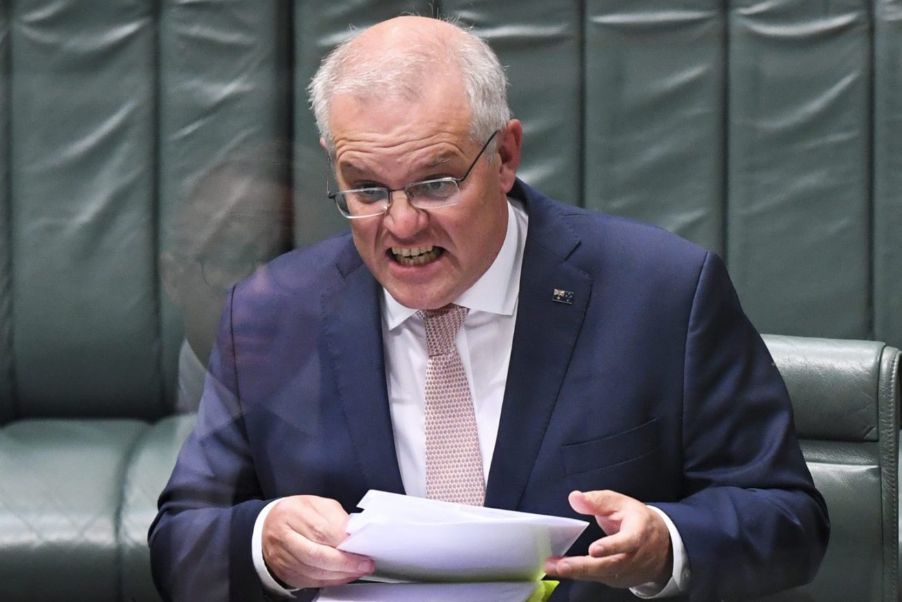 Former Prime Minister Scott Morrison (top) speaks during Question Time in the previous parliament. (AAP Image/Lukas Coch) 