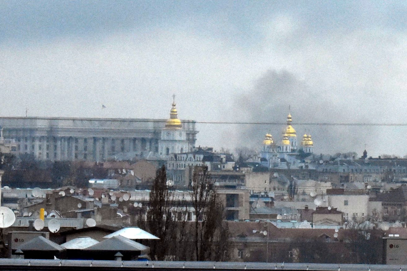 A Russian plane was shot down in Kyiv and crashed into a residential building. (Kyodo via AP Images) Kyodo