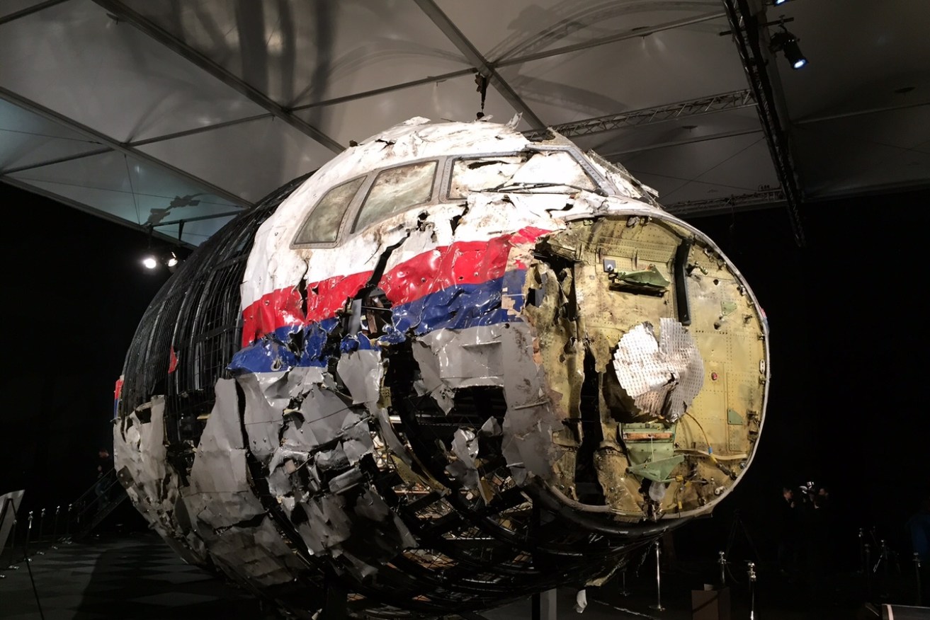 The reconstructed front of the Malaysia Airlines plane that was downed by a missile over Ukraine, killing 298 people, Gilze-Rijen Air Force Base, The Netherlands, Oct. 13, 2015. Parts of the cockpit and business class were reconstructed from wreckage retrieved from Ukraine and brought to the Netherlands where the crash investigation was based. (AAP Image/Lloyd Jones) 