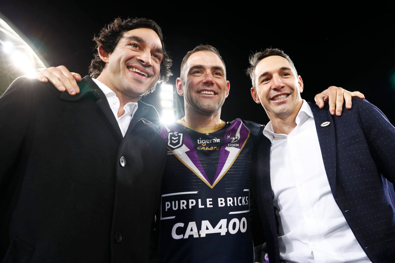 Cameron Smith of the Storm (centre) poses for a photo with Billy Slater (right) and Johnathan Thurston.  (AAP Image/Daniel Pockett) 