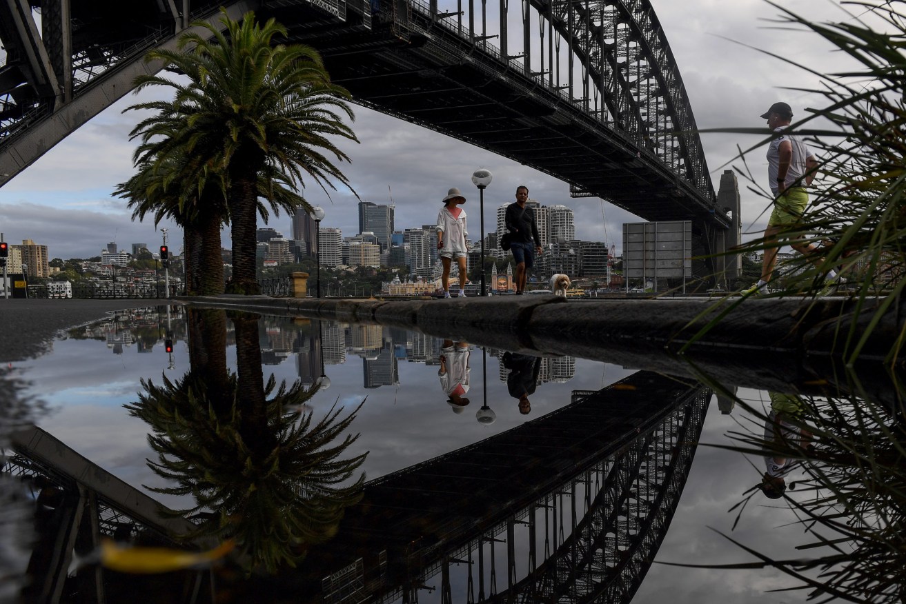 Multiple flood warnings are current for vast swathes of NSW as heavy rain batters the state, where saturated soil and swollen rivers could lead to landslides. (AAP Image/Bianca De Marchi) 