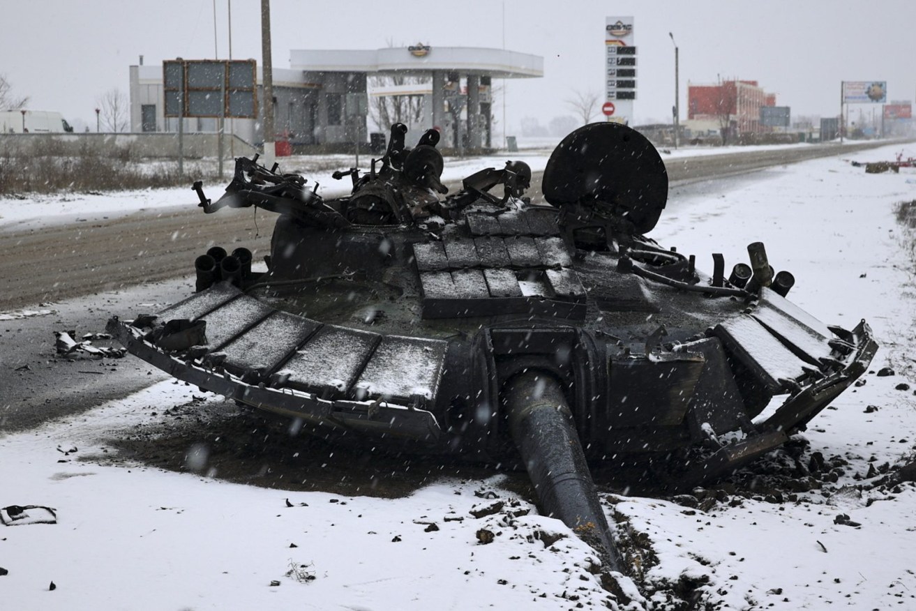 A turret of burned Russian tank is left abandoned after the Ukrainian army attacked it the previous day near the city of Kharkiv, Ukraine. (EPA/SERGEY KOZLOV)