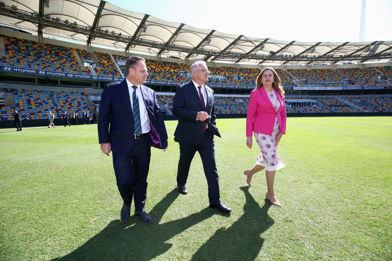 Brisbane Lord Mayor Adrian Schrinner, former Australian Prime Minister Scott Morrison and Queensland Premier Annastacia Palaszczuk at the Gabba before making the City Deal announcement. (AAP Image/Jono Searle)