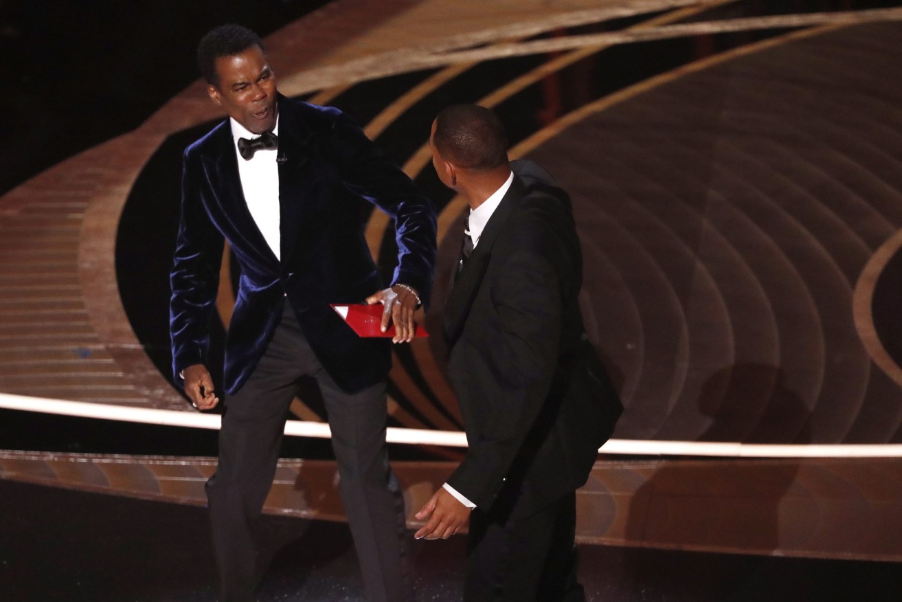 Actor Will Smith (R) swings at US actor Chris Rock during the 94th annual Academy Awards ceremony at the Dolby Theatre in Hollywood.  EPA/ETIENNE LAURENT