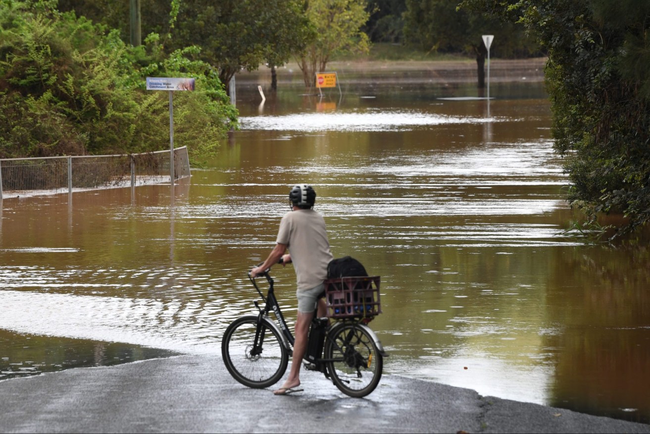 The threat of floods in  Queensland is not over, according to Floodmapp
 (AAP Image/Darren England) 
