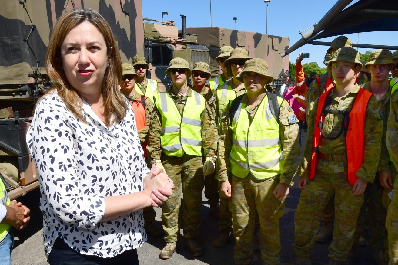 Queensland Premier Annastacia Palaszczuk (left) is seen meeting members of the ADF (Australian Defence Force) before a media conference at the Goodna Function Centre in Ipswich, Tuesday,.  (AAP Image/Darren England) 