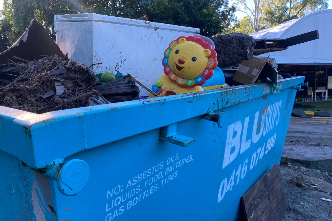 The smile of a child's toy brought a brief respite from the suffocating muck that surrounds it. Image: Rebecca Levingston