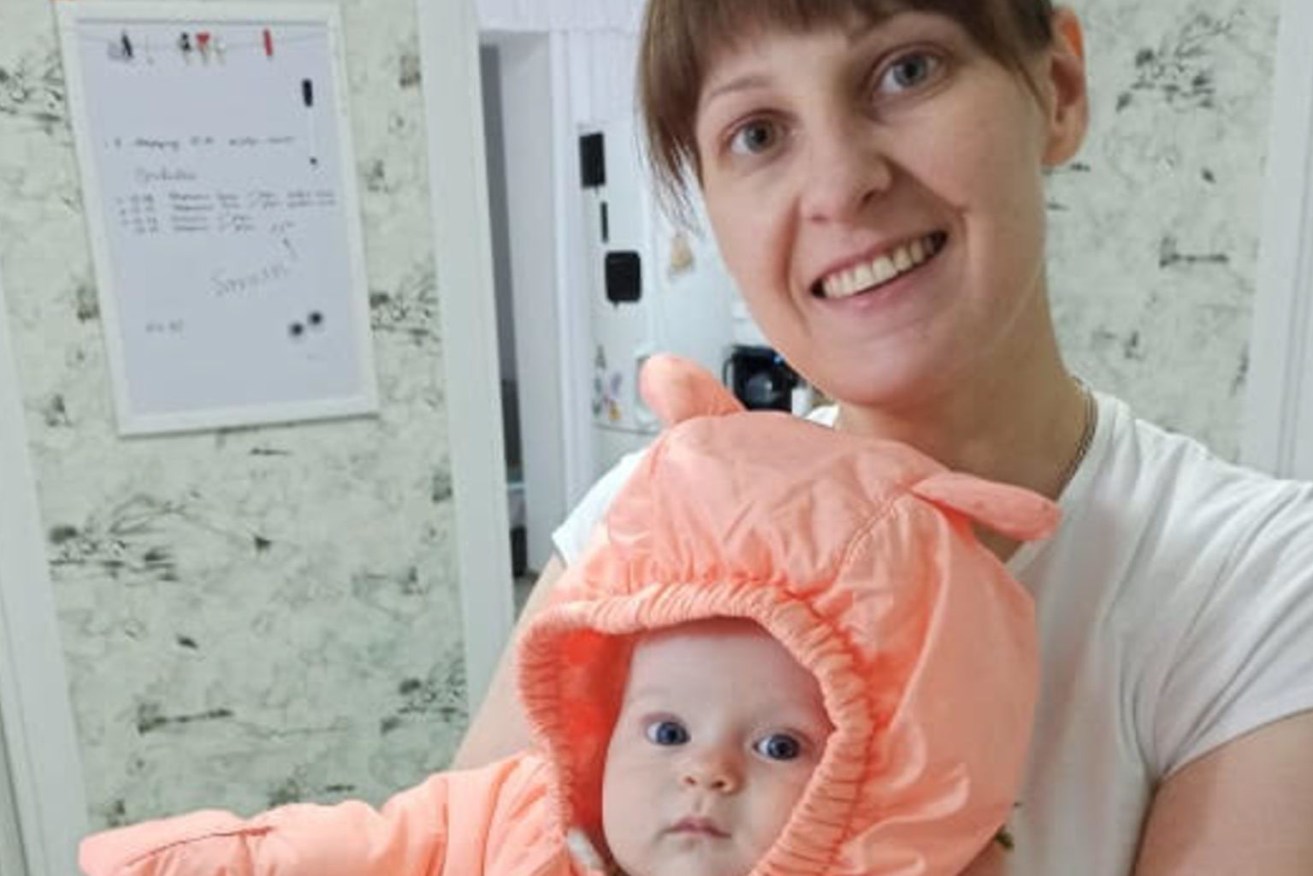 A supplied image obtained, shows Iryna Zaiets and her nine month old baby Oksana at their home in Ukraine. An estimated 100,000 Ukrainians have fled their homes, with many trying to cross into neighbouring countries, after Russian President Vladimir Putin launched a military invasion in Ukraine. (AAP Image/Supplied by Olha Lyeskakova) 