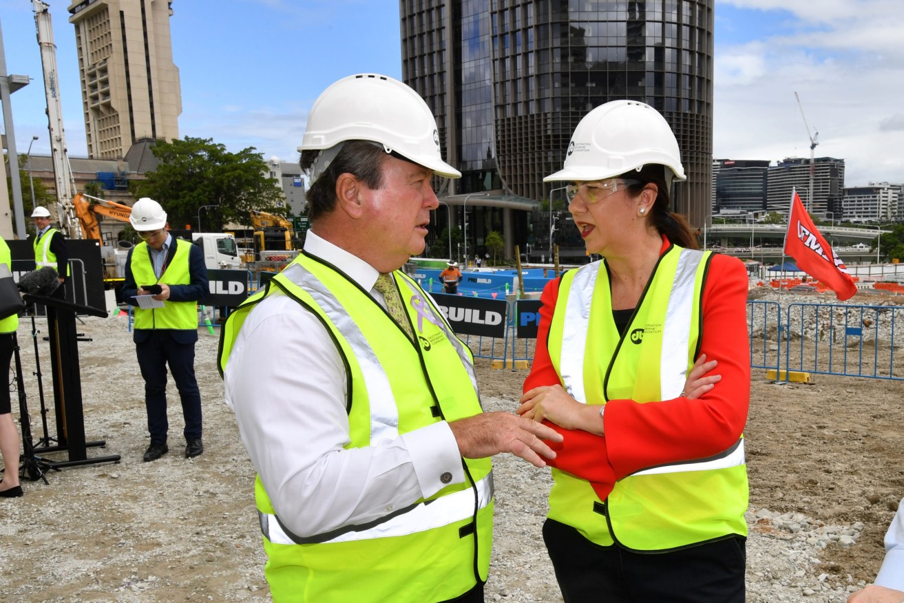 Outgoing Star Entertainment Group Chairman John O'Neill pictured with Premier Annastacia Palaszczuk at the Queens Wharf project site in 2018.  (AAP Image/Darren England) 