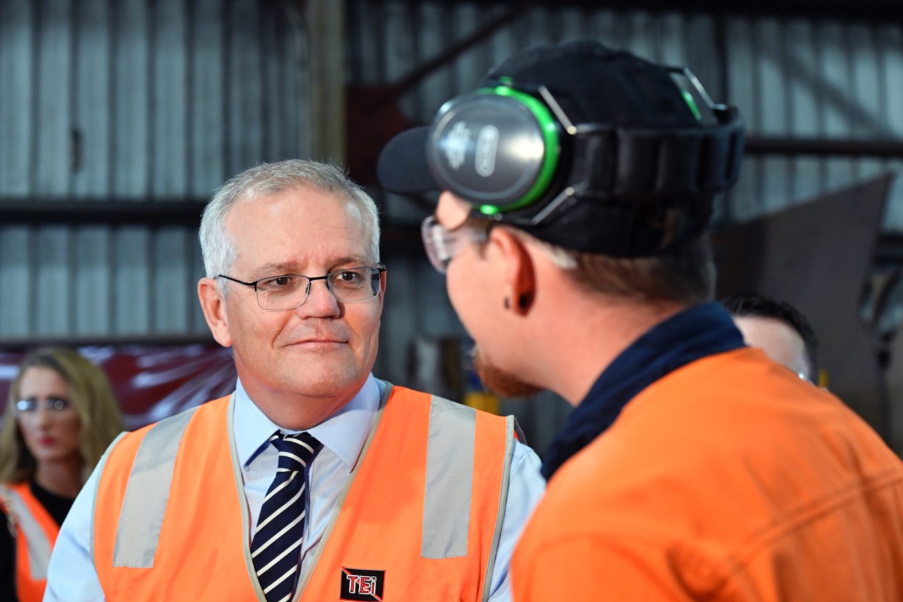 Prime Minister Scott Morrison during a visit to TEi engineering and steel fabrication company  in Townsville, in the seat of Herbert. Tuesday, April 26, 2022. (AAP Image/Mick Tsikas)