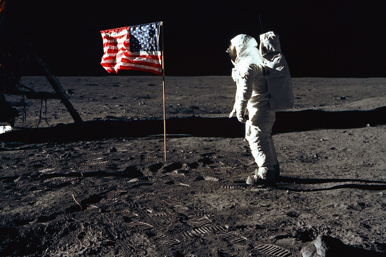 Astronaut Buzz Aldrin, lunar module pilot of the first moon landing, poses for a photograph beside the deployed United States flag on the lunar surface. (Image: NASA)