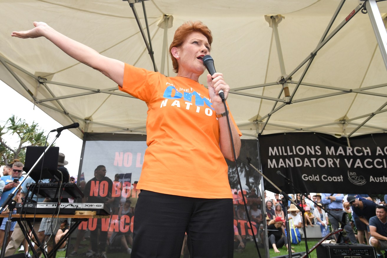 One Nation leader Senator Pauline Hanson is seen speaking to the crowds during protest against the Queensland Government's mandatory vaccination laws on the Gold Coast, Saturday, November 27, 2021. A series of rallies will be held across Australia against mandatory vaccination. (AAP Image/Darren England) NO ARCHIVING