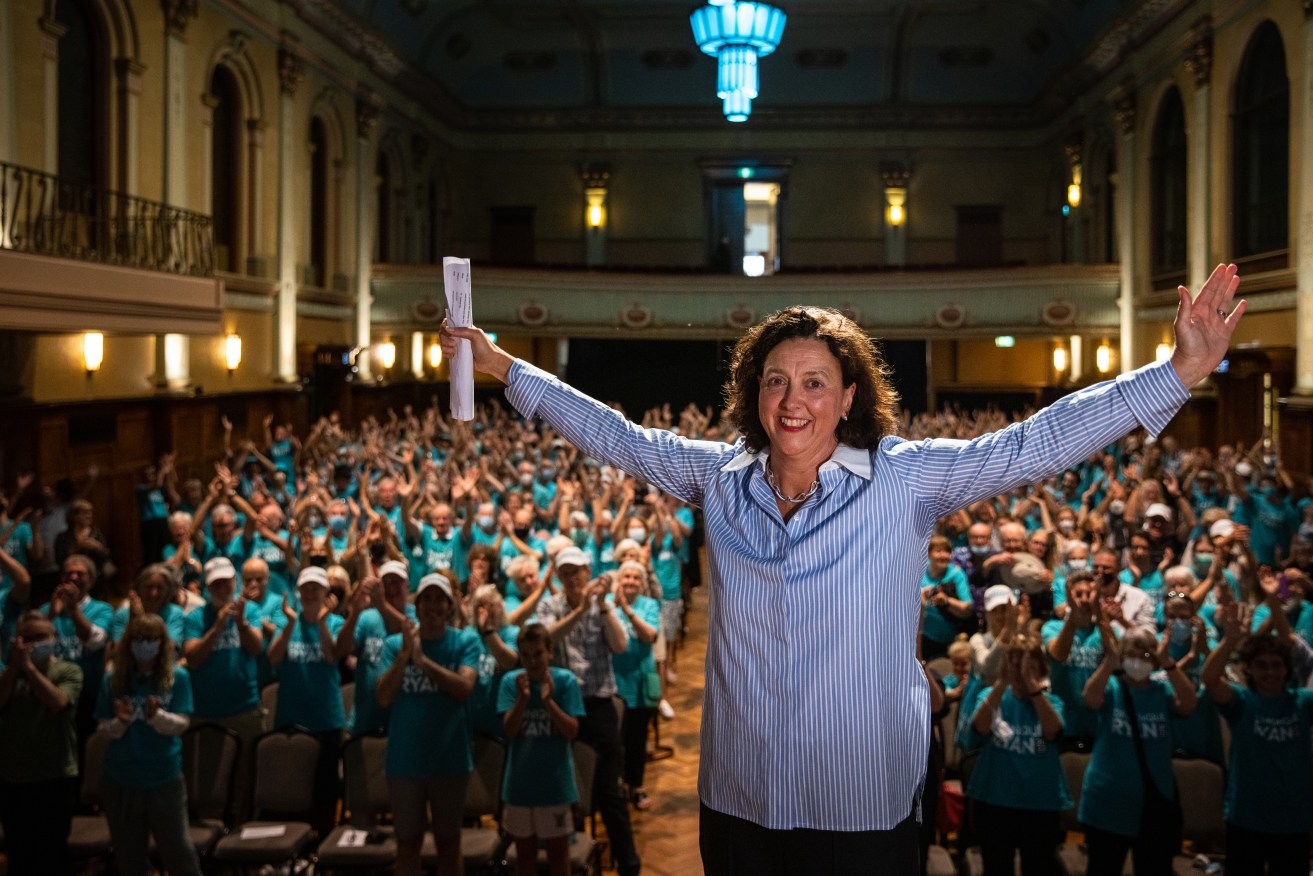 Treasurer Josh Frydenberg is under threat from teal independent Dr. Monique Ryan, pictured with with her supporters during an election campaign launch at Hawthorn Arts Centre in Melbourne. (AAP Image/Diego Fedele)
